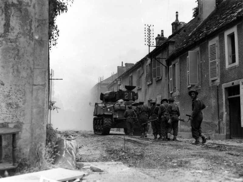 Soldiers and tank in village street