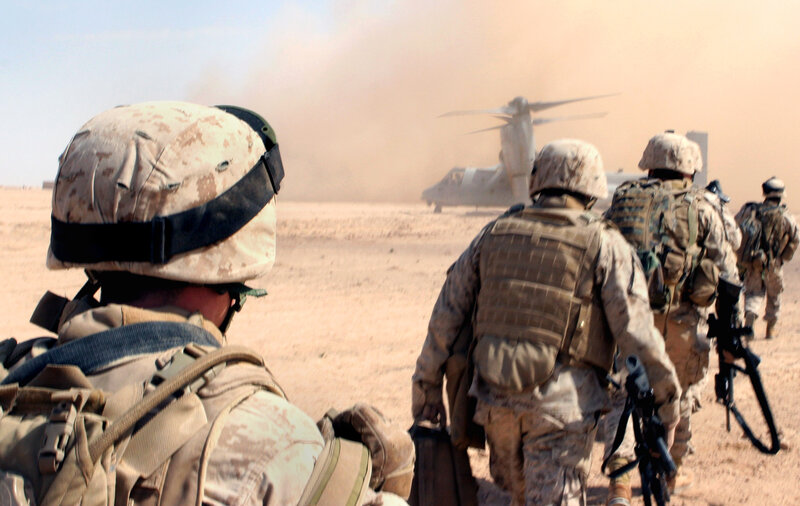 Soldiers approaching helicopter