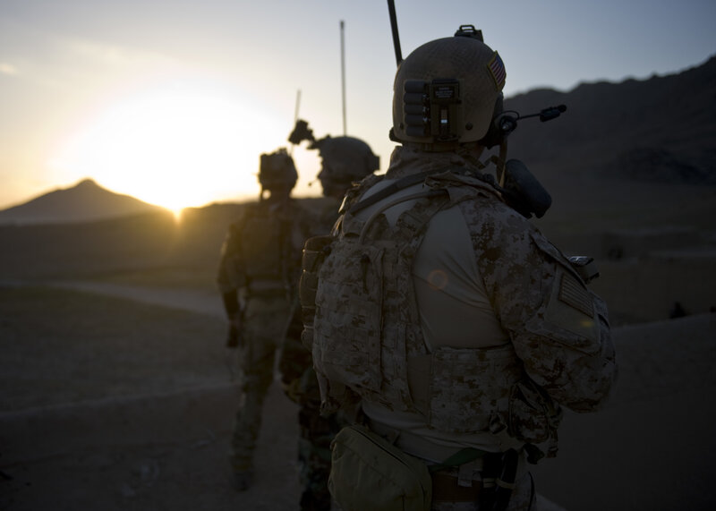 Soldiers at sunset in desert