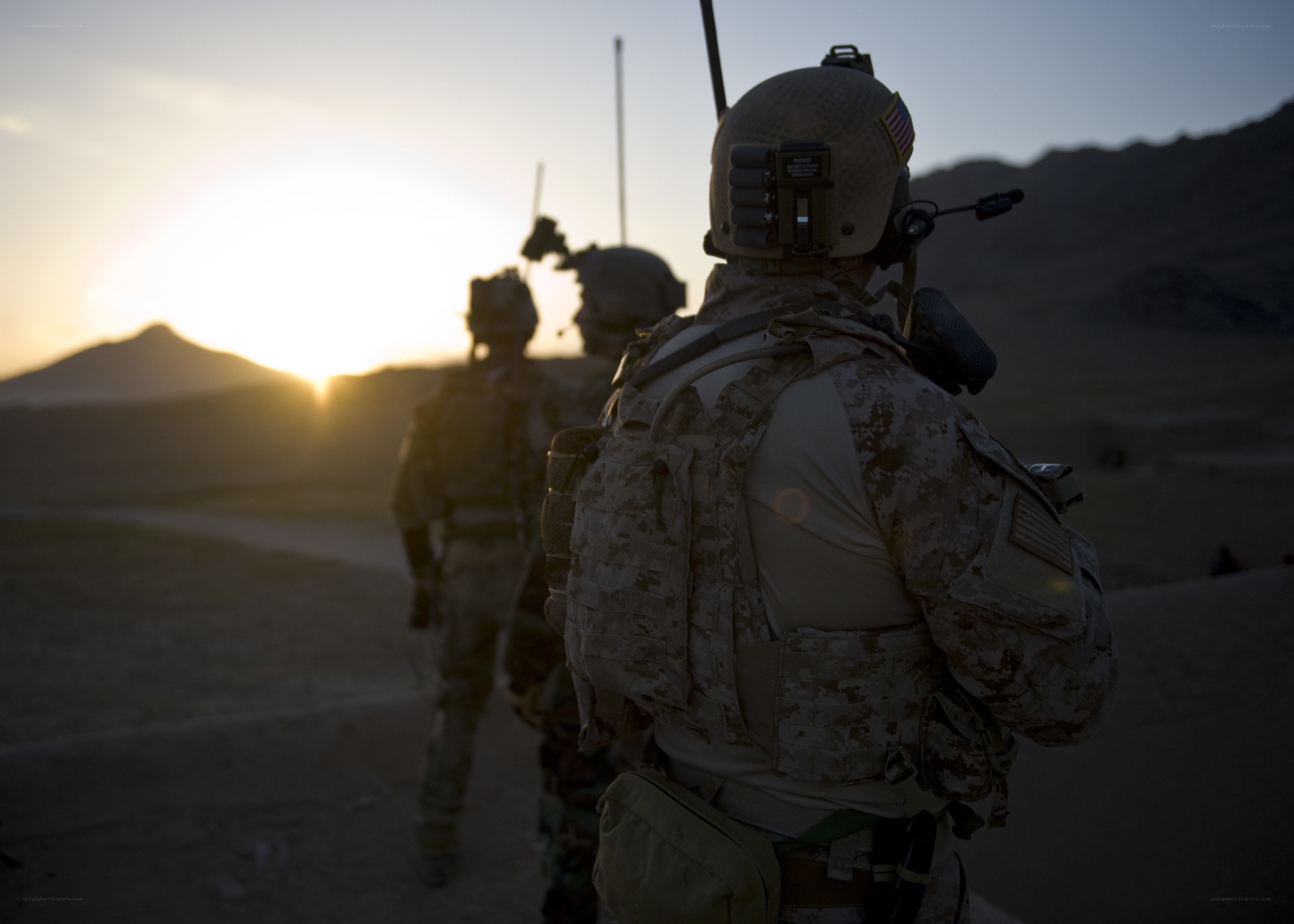 Soldiers at sunset in desert