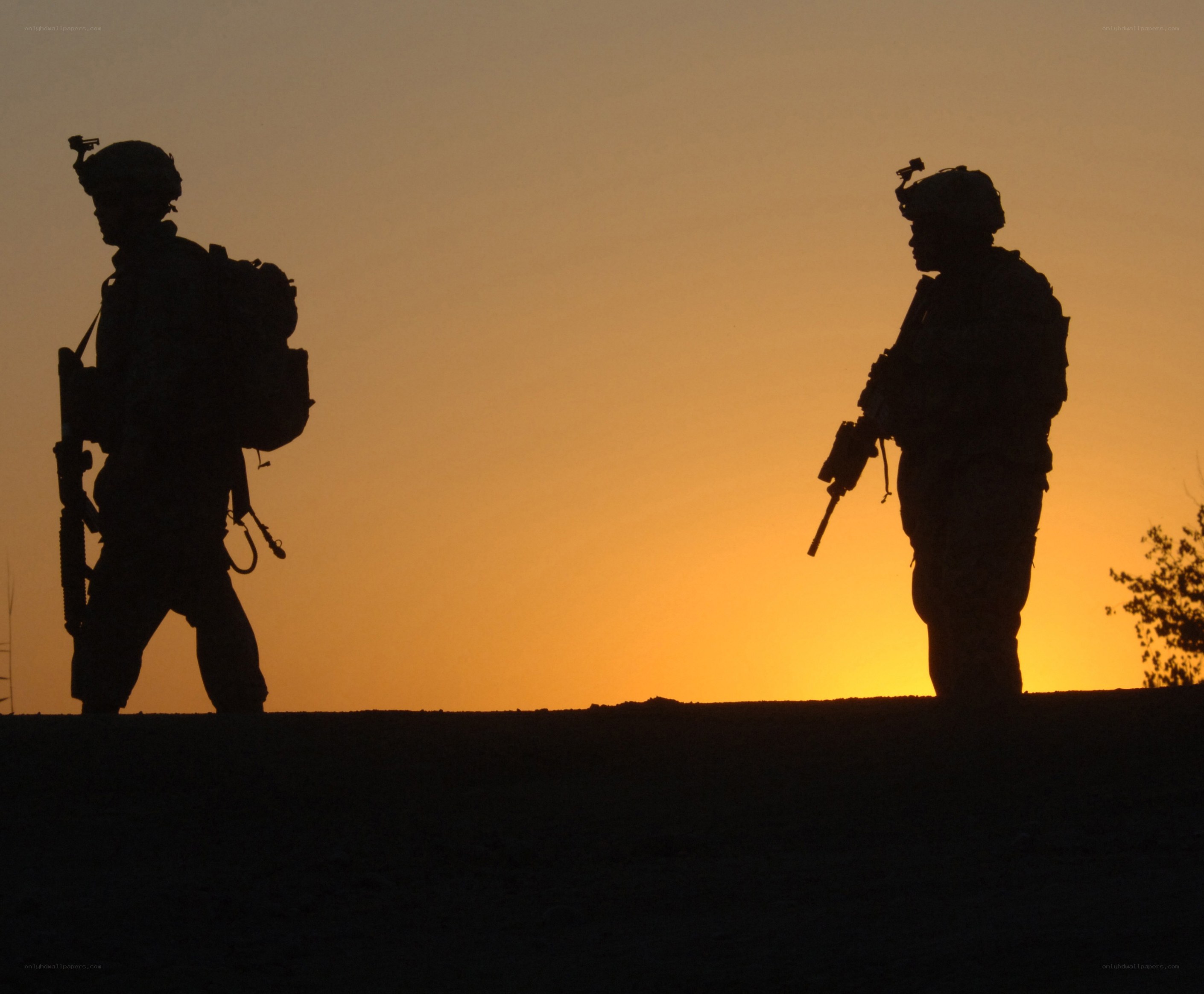 Soldiers at sunset silhouette