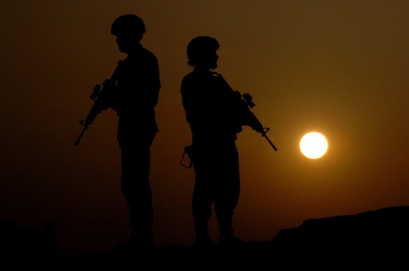 Soldiers at sunset silhouette