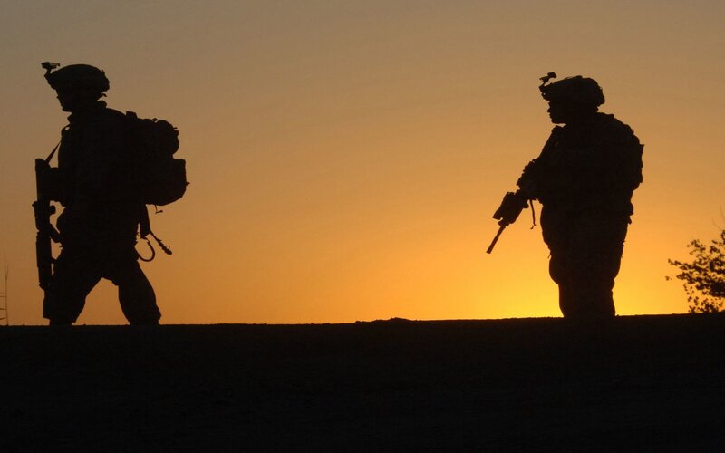 Soldiers at sunset silhouette