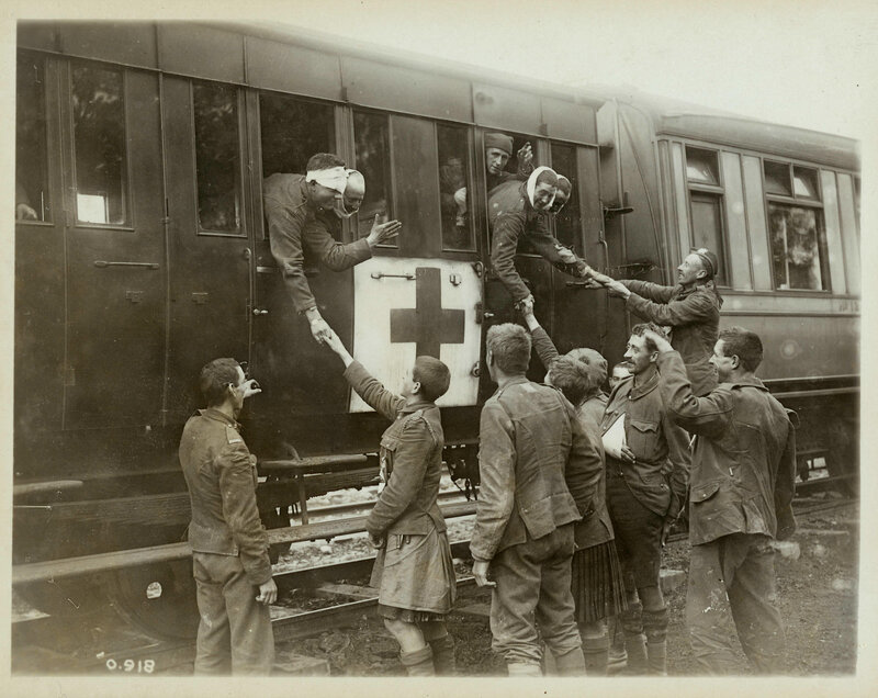 Soldiers being helped from a train
