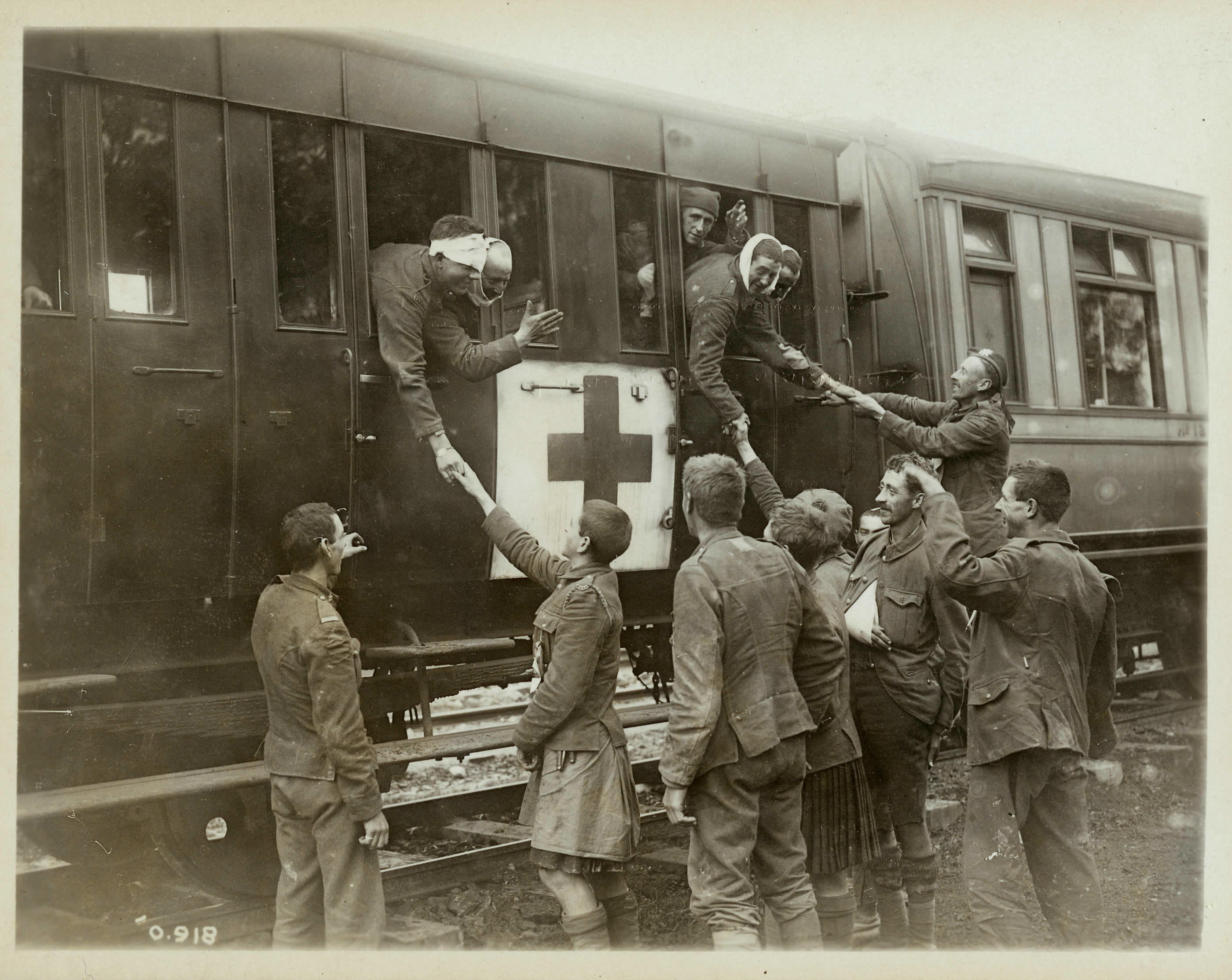 Soldiers being helped from a train