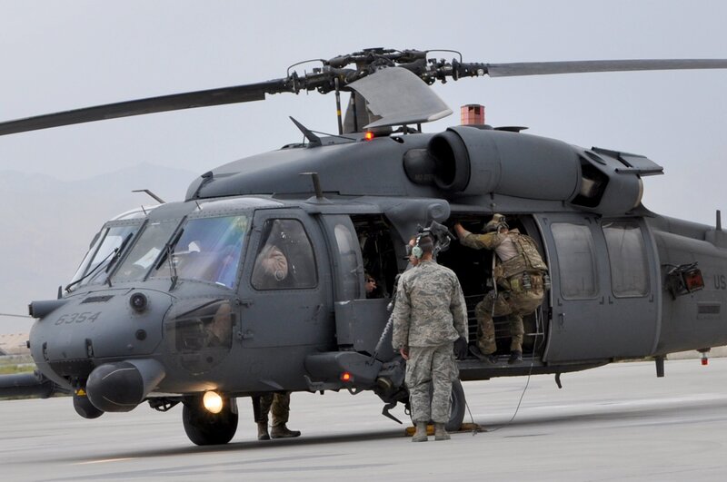 Soldiers boarding a military helicopter