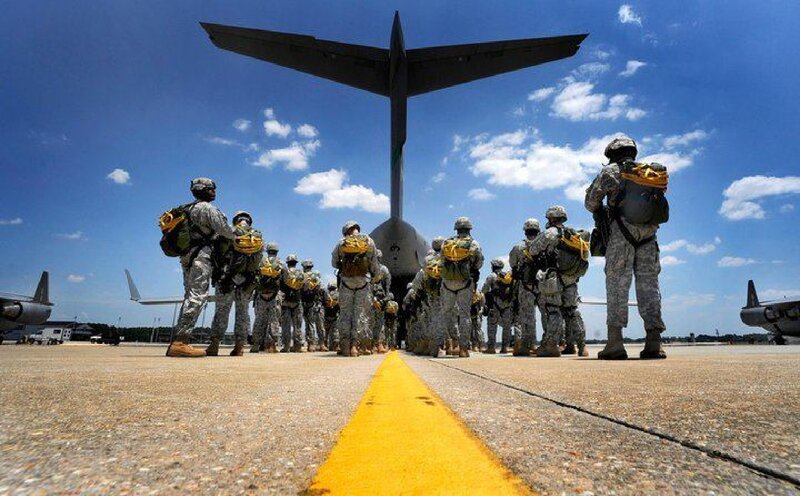 Soldiers Boarding Aircraft — Blue