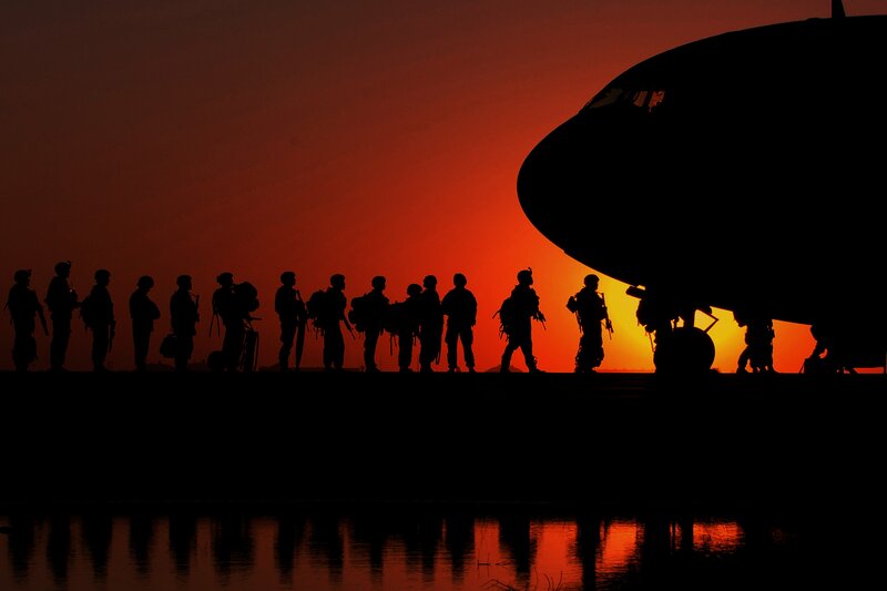 Soldiers Boarding Aircraft — Red