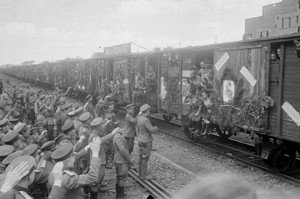 Soldiers boarding decorated train