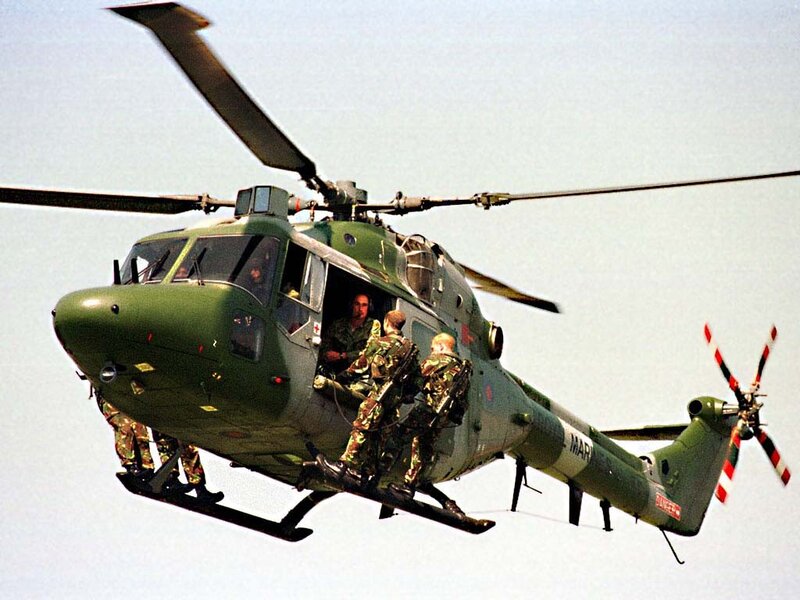 Soldiers boarding military helicopter