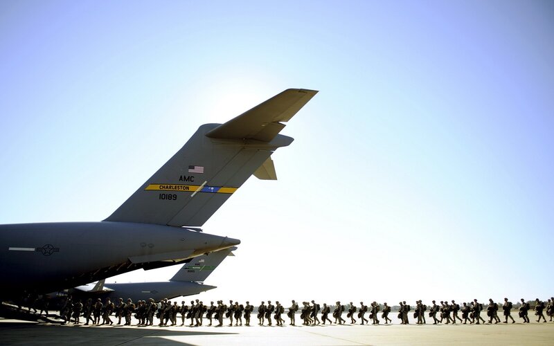 Soldiers boarding military transport