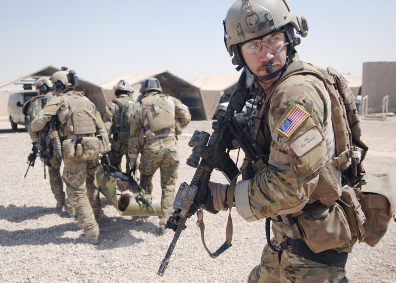 Soldiers carrying a wounded comrade