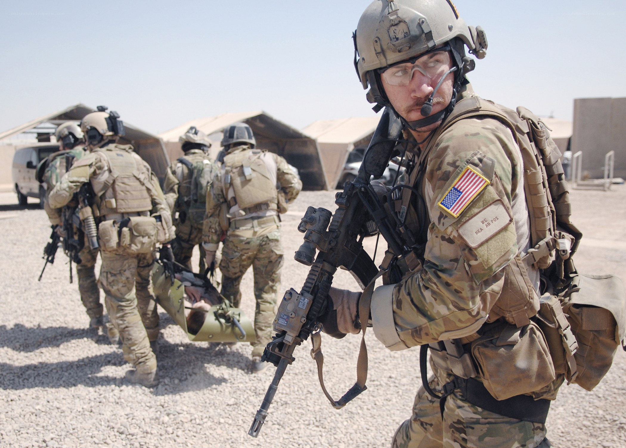 Soldiers carrying a wounded comrade