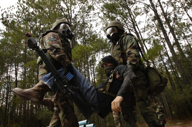 Soldiers carrying injured comrade