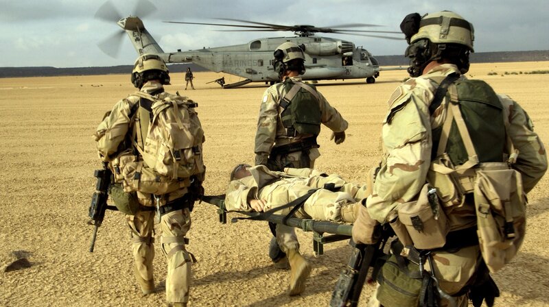 Soldiers Carrying Wounded — Tan