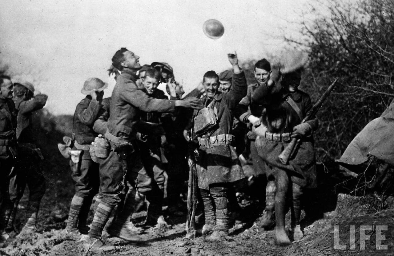 Soldiers celebrating in a trench