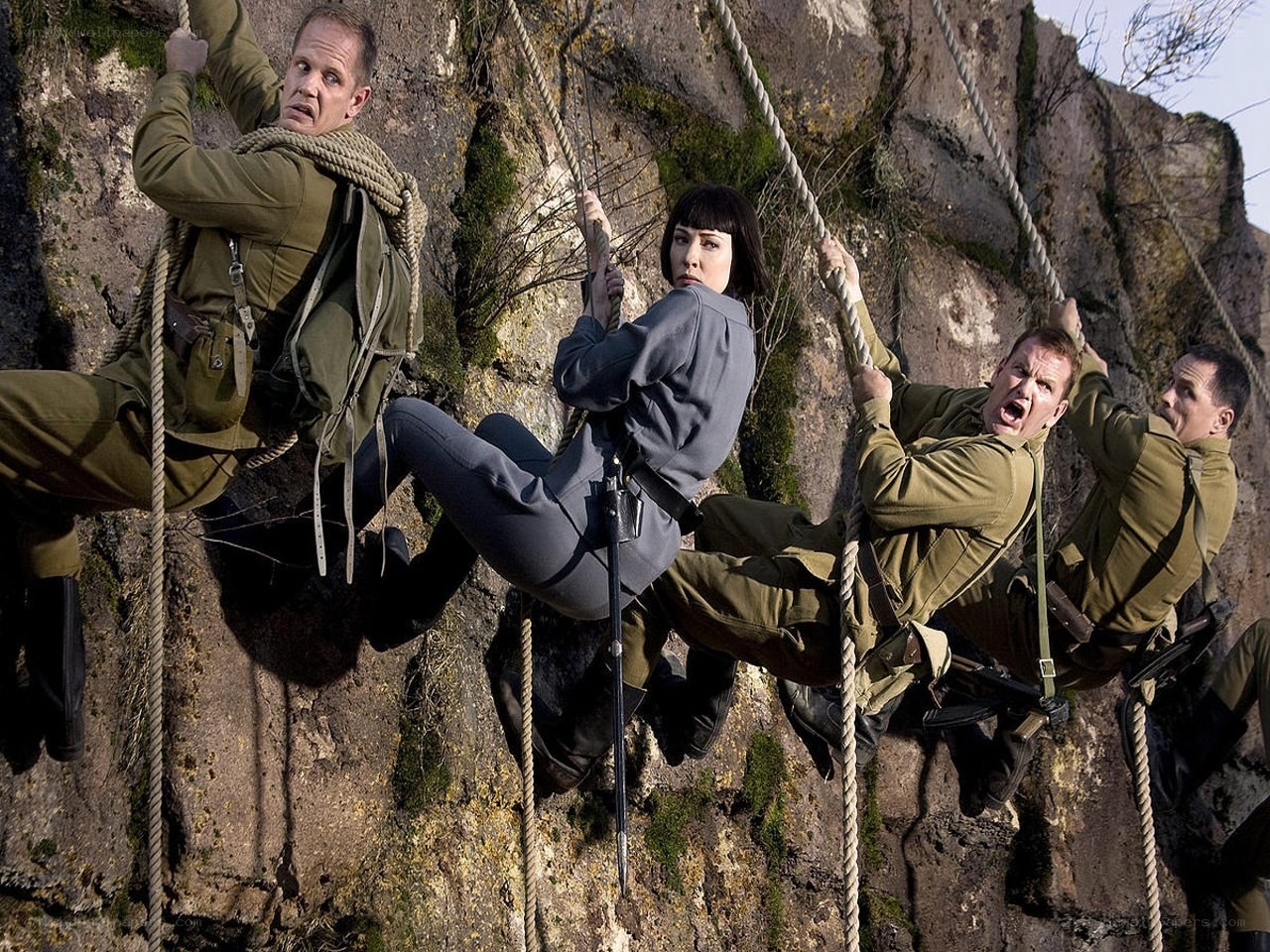 Soldiers climbing a cliff