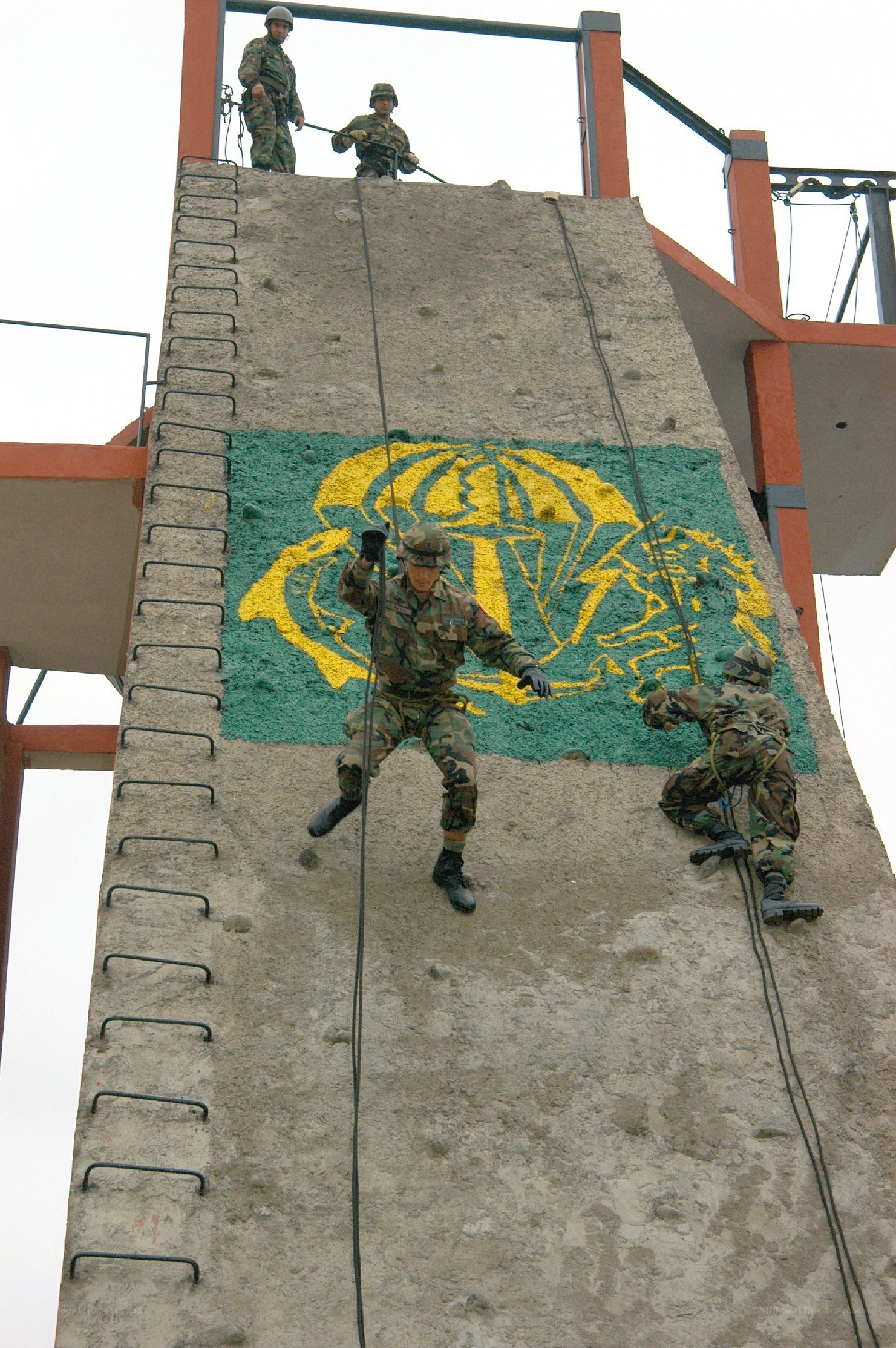 Soldiers climbing training wall