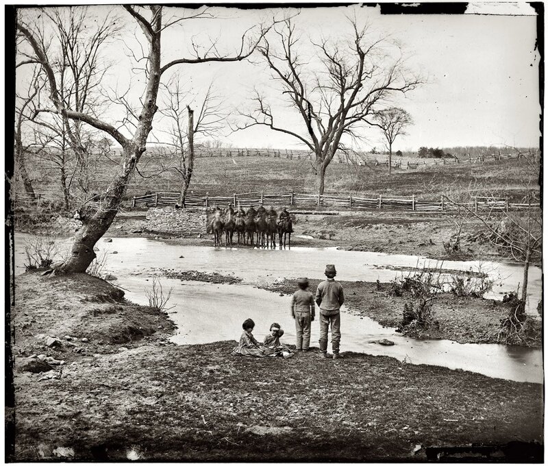 Soldiers crossing a river
