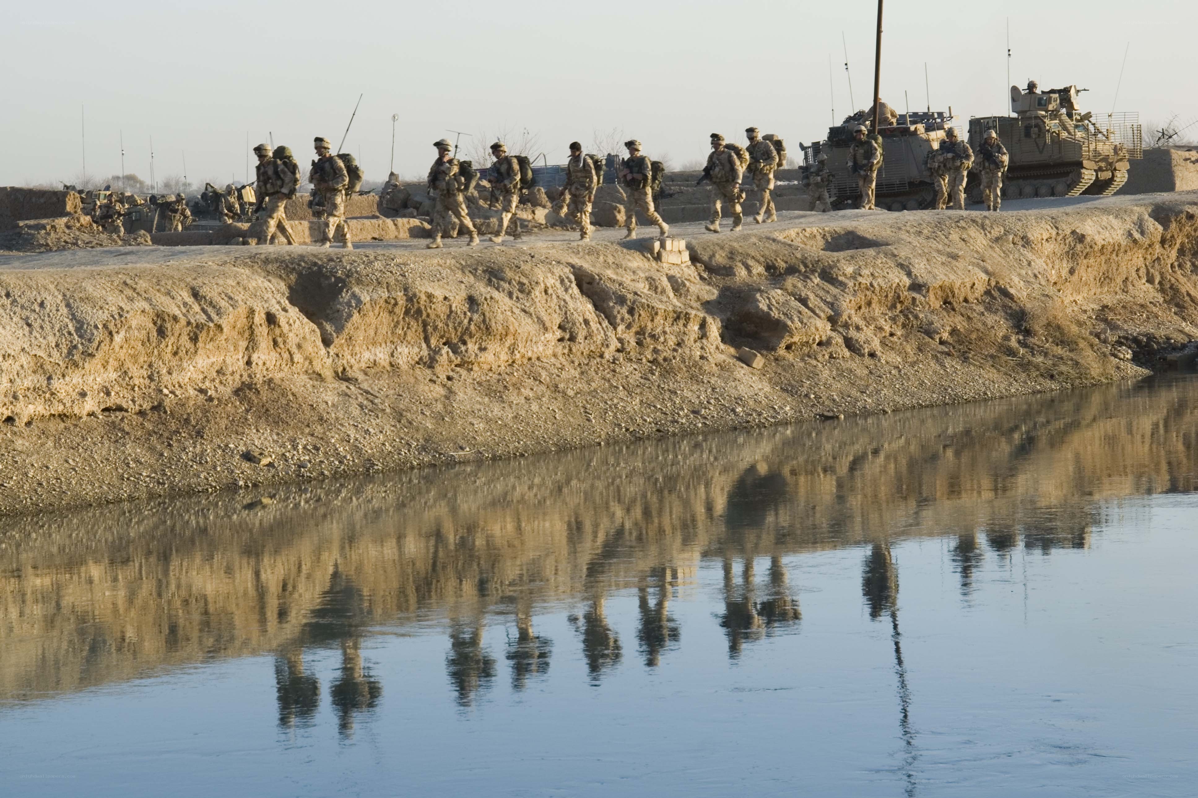 Soldiers crossing a river
