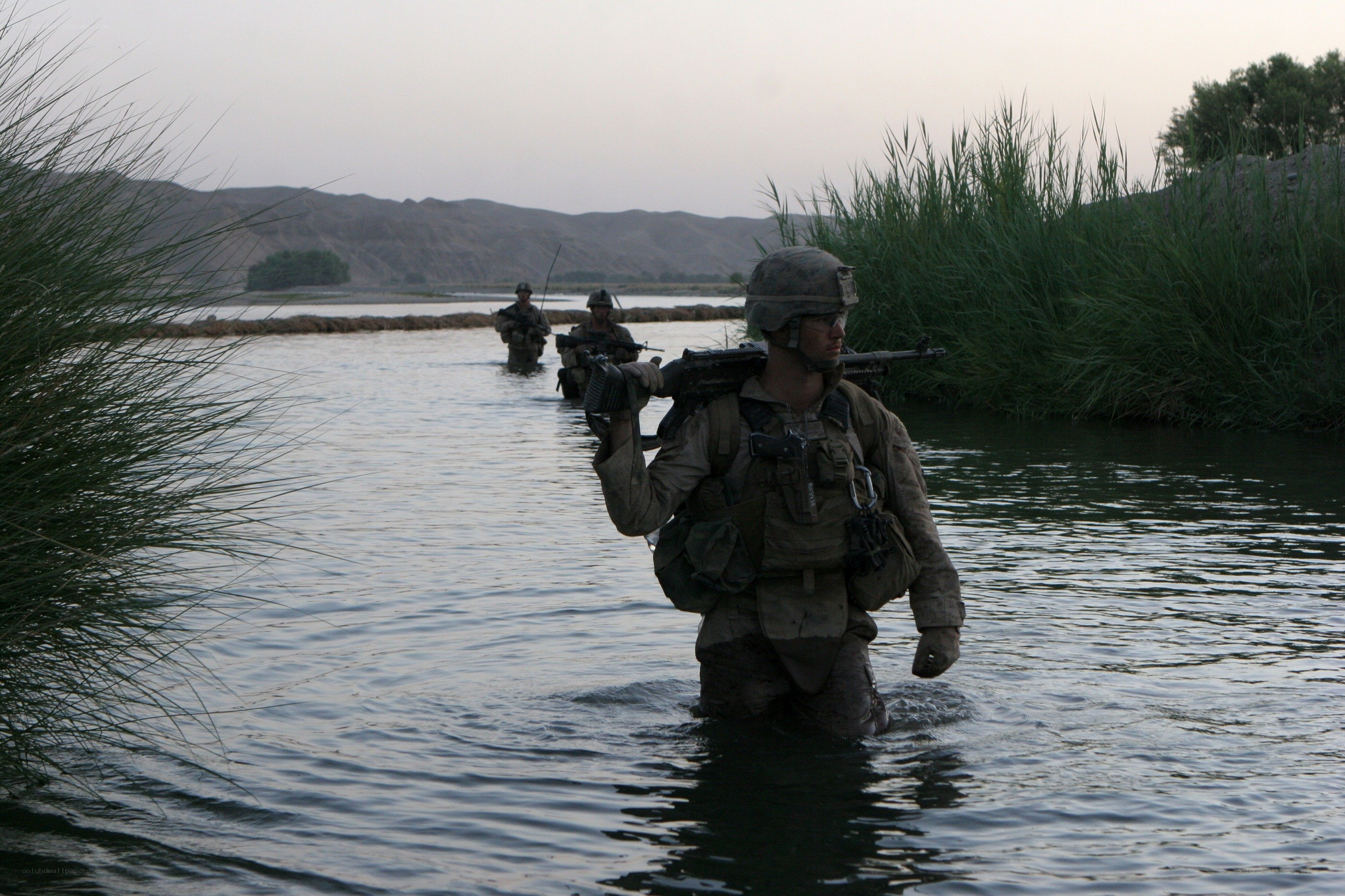 Soldiers crossing a river