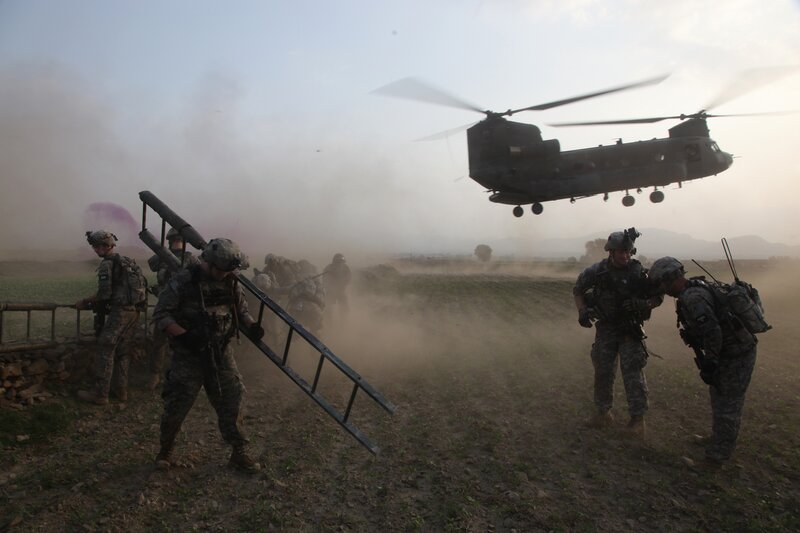 Soldiers disembarking from helicopter