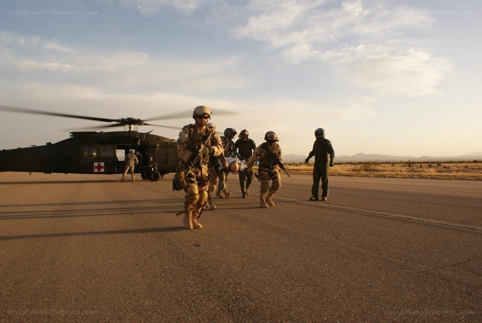 Soldiers evacuating wounded from helicopter