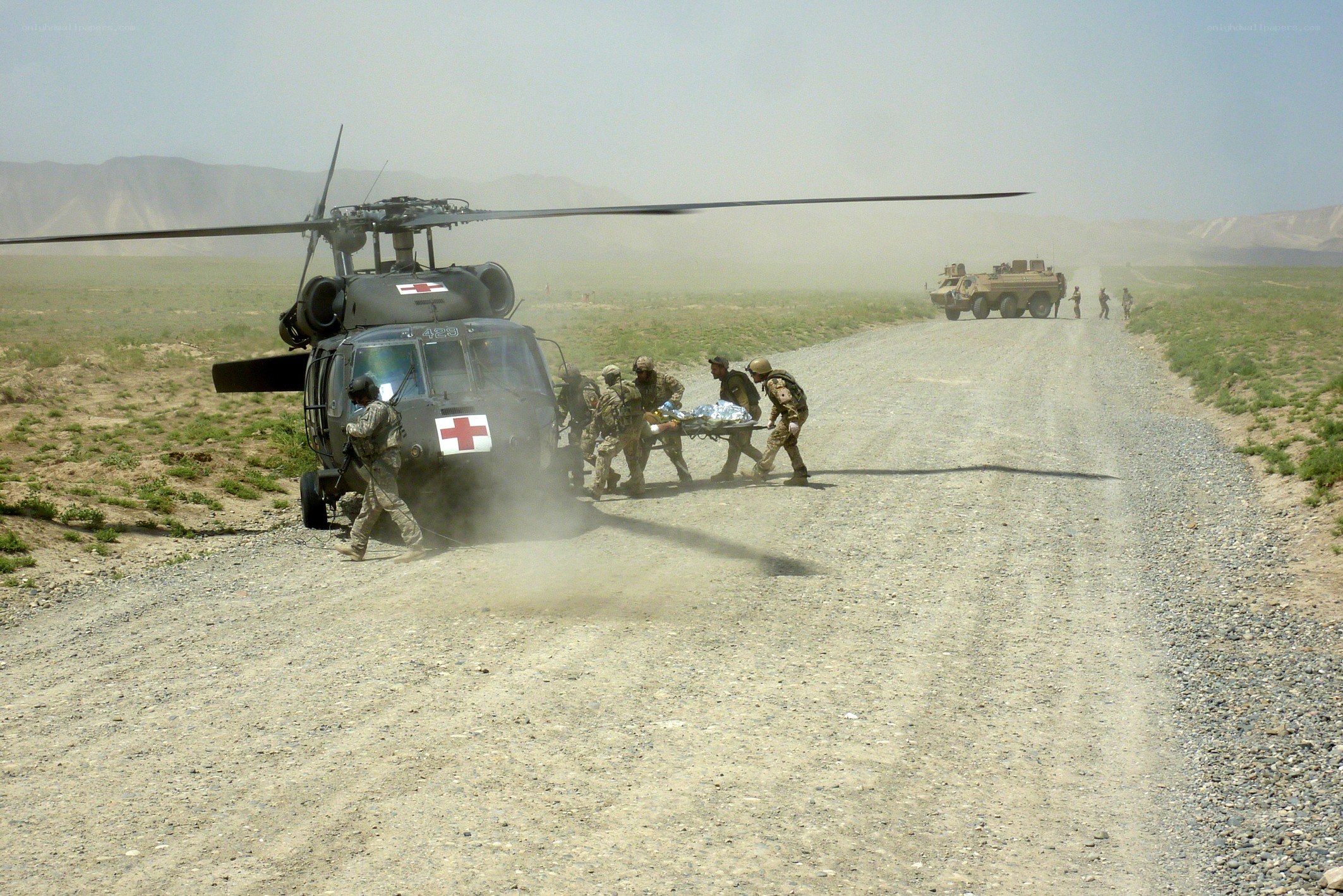 Soldiers evacuating wounded from helicopter