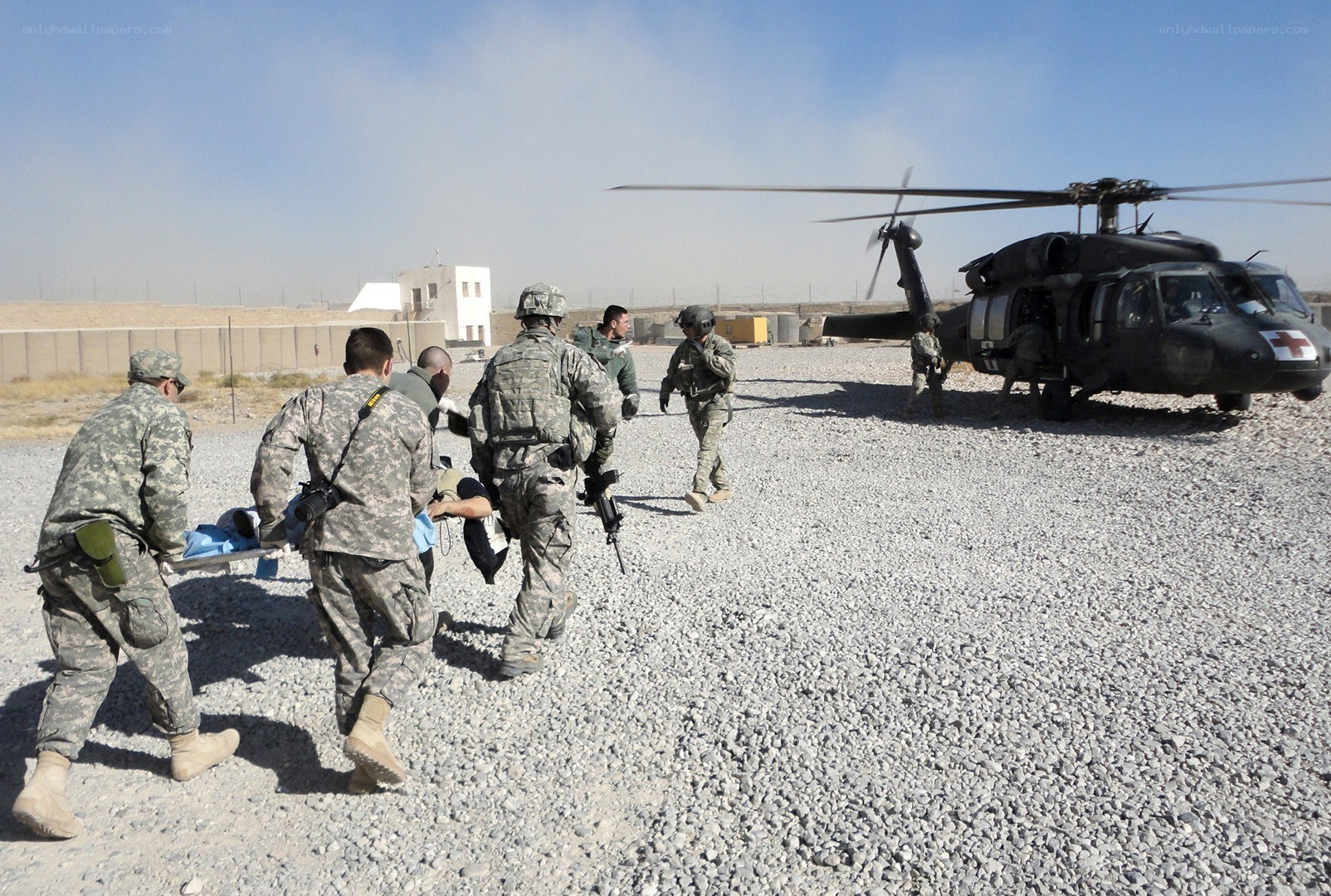Soldiers evacuating wounded on stretcher