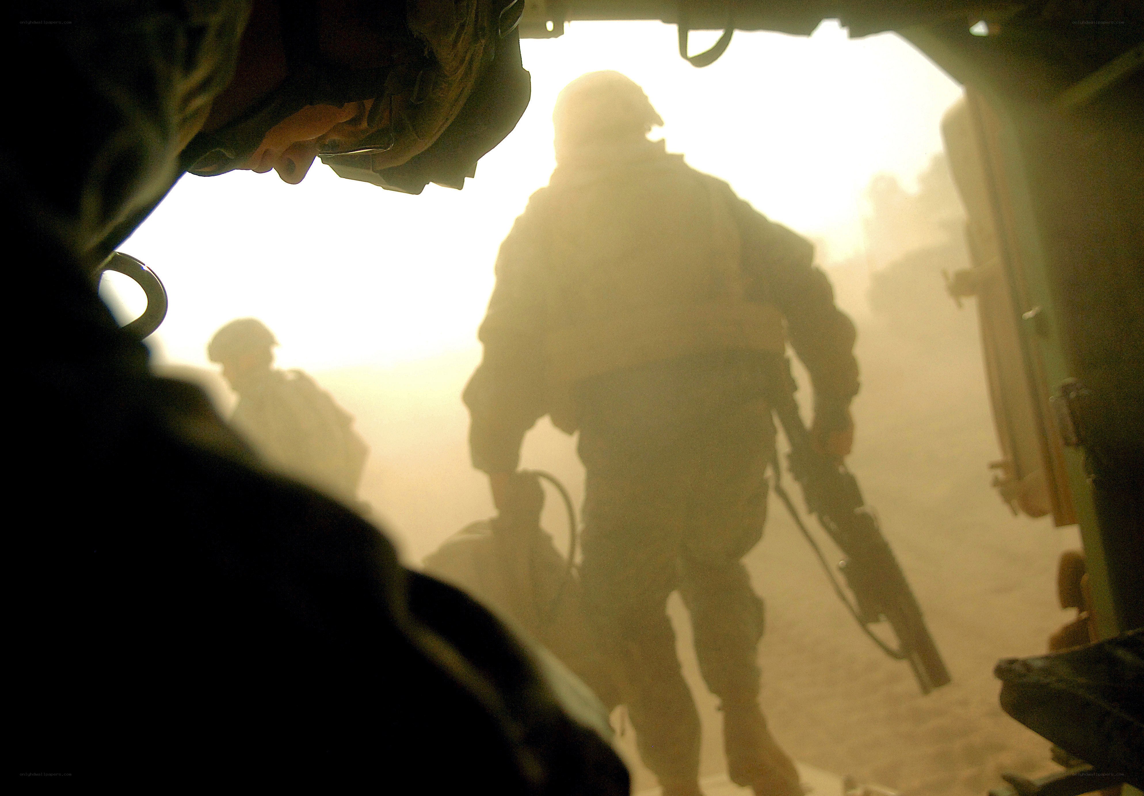Soldiers exiting armored vehicle
