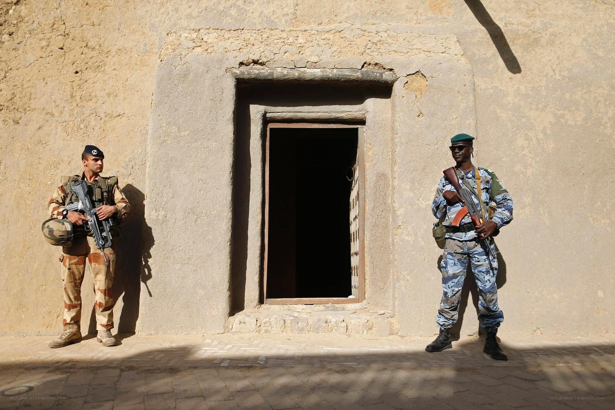 Soldiers guarding a doorway