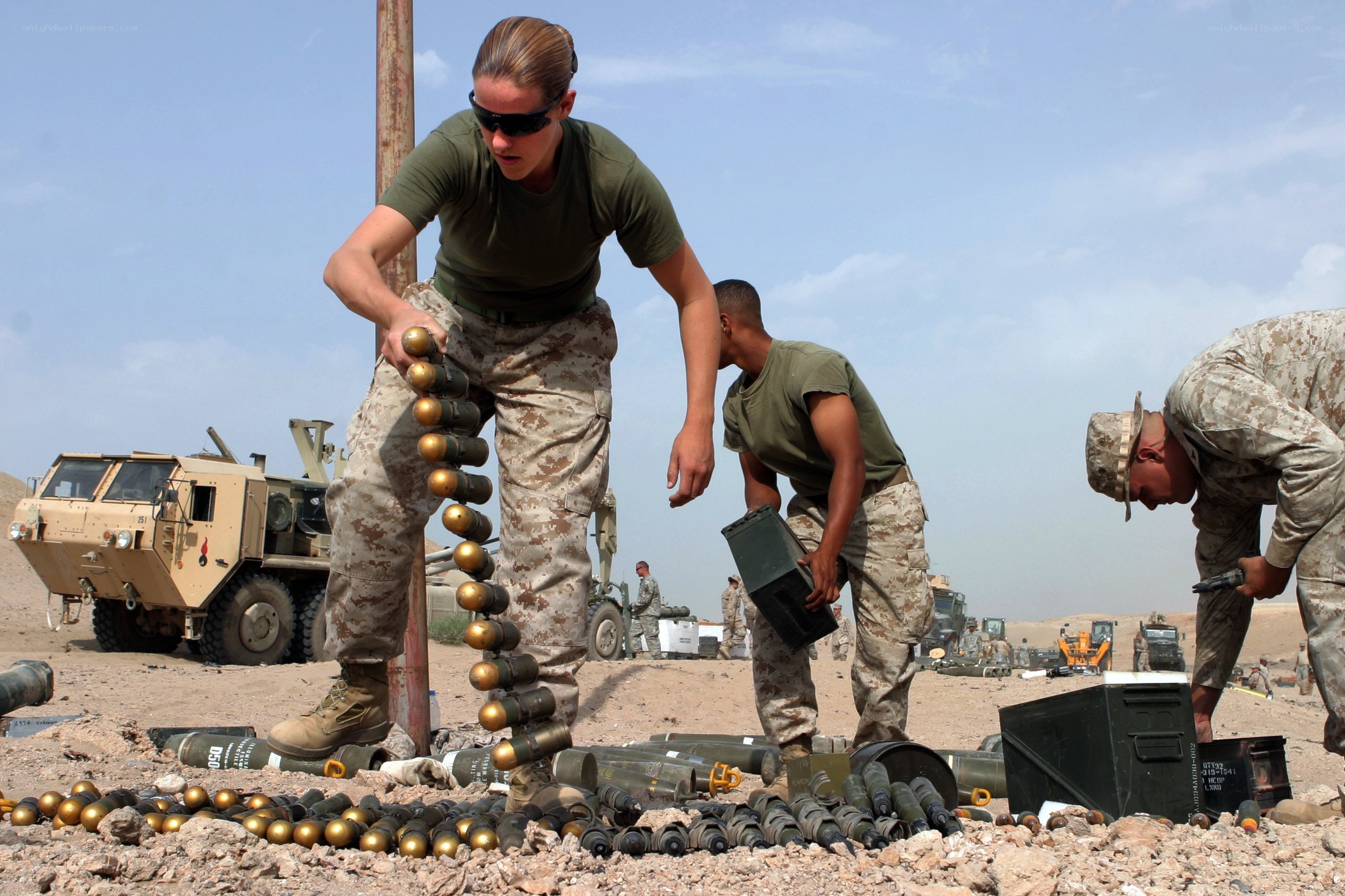 Soldiers handling ammunition