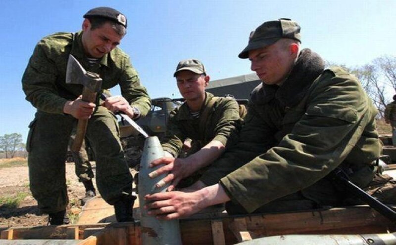 Soldiers Handling Artillery Shell