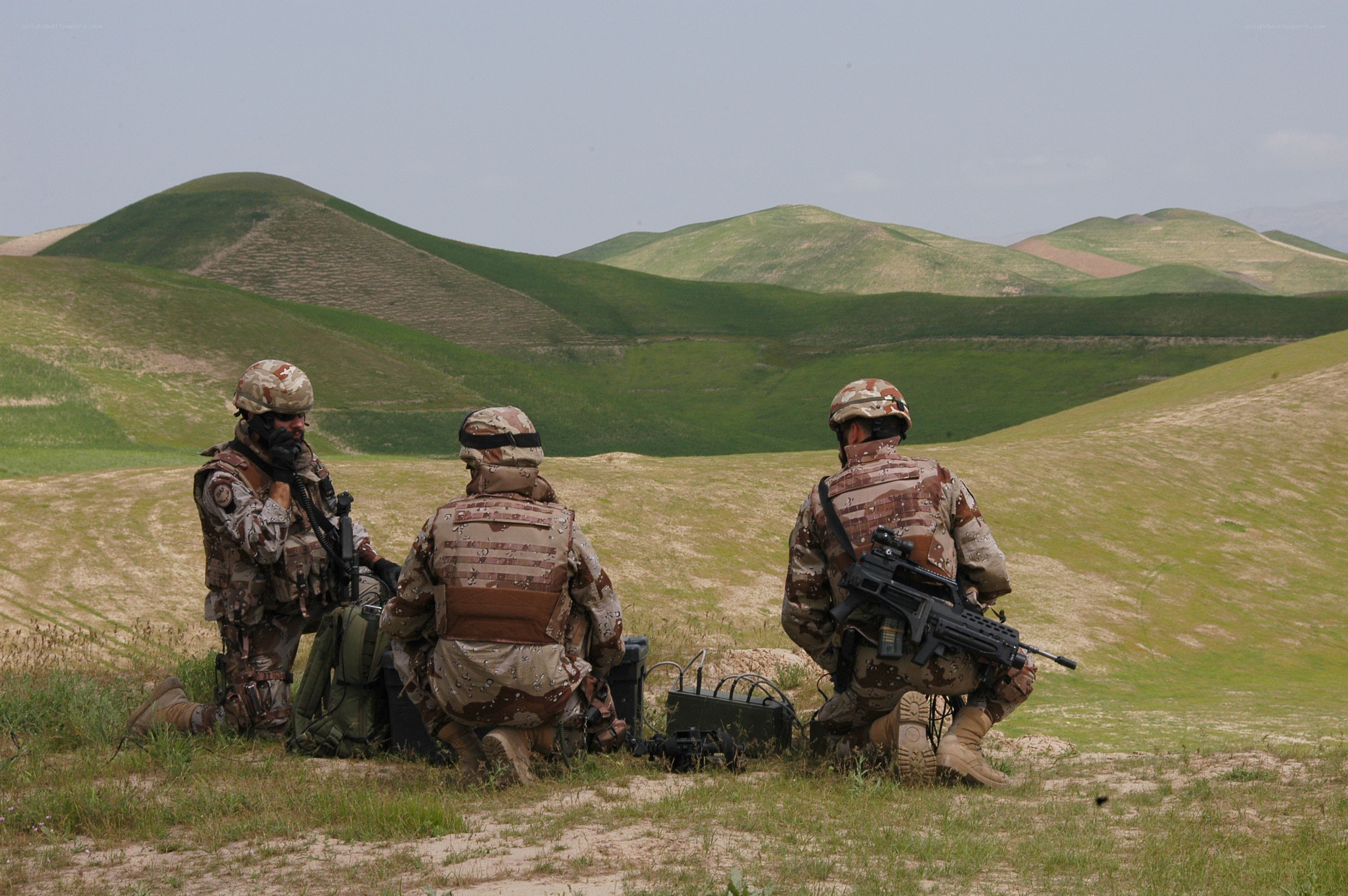 Soldiers in a field with equipment