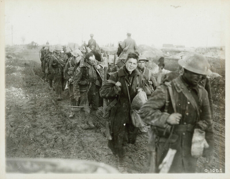 Soldiers in a muddy trench
