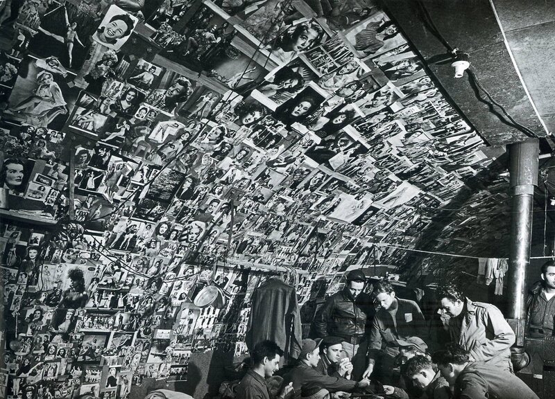 Soldiers in a photo-covered room