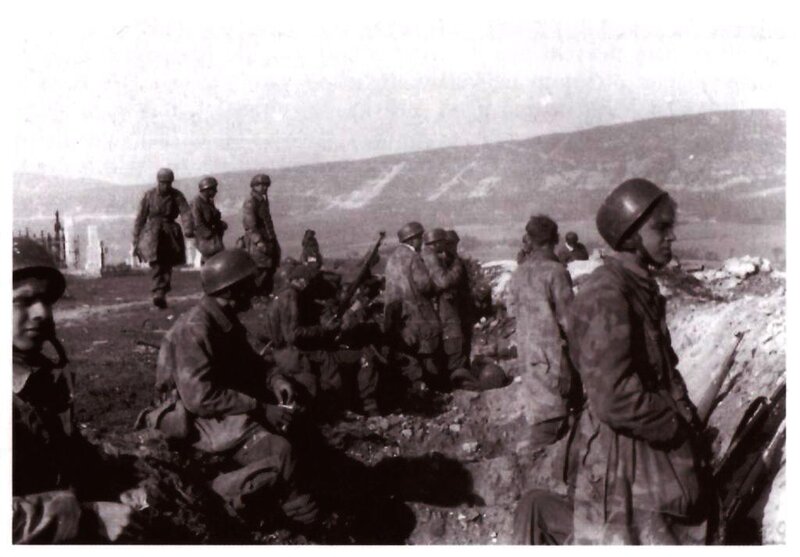 Soldiers in a trench during war
