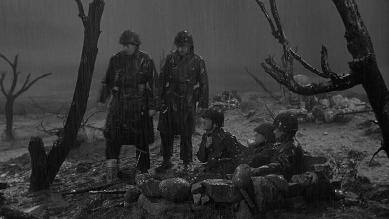 Soldiers in a war-torn landscape
