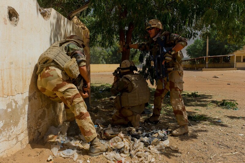 Soldiers in Combat — Brown, Tense, Afternoon, Photograph, Wall, Tree