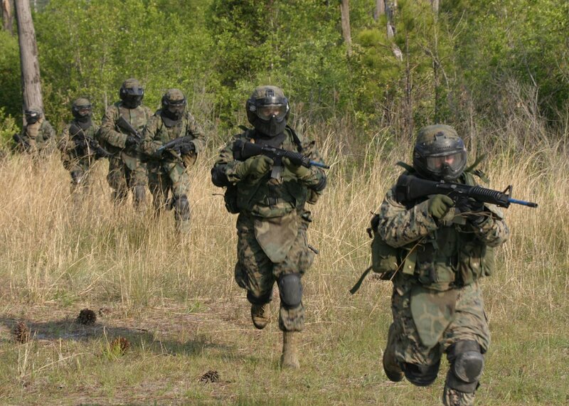 Soldiers in combat gear running