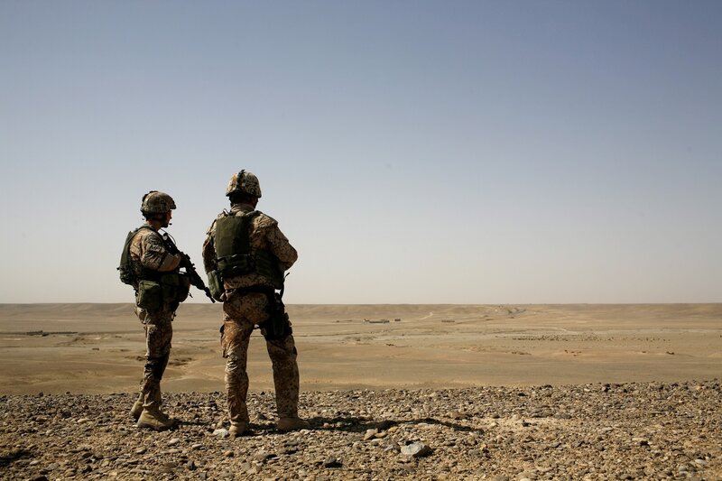 Soldiers in desert landscape