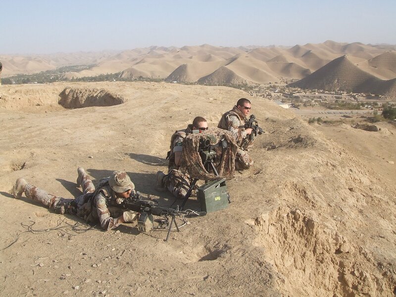Soldiers in desert terrain