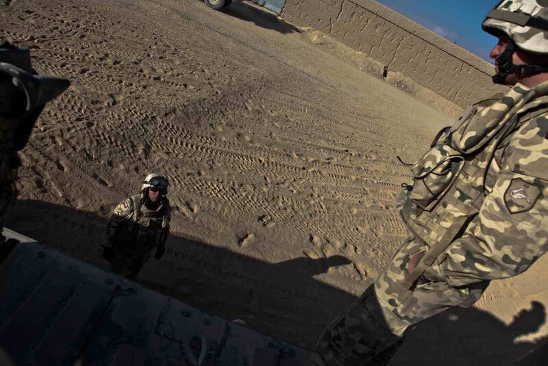 Soldiers in desert terrain