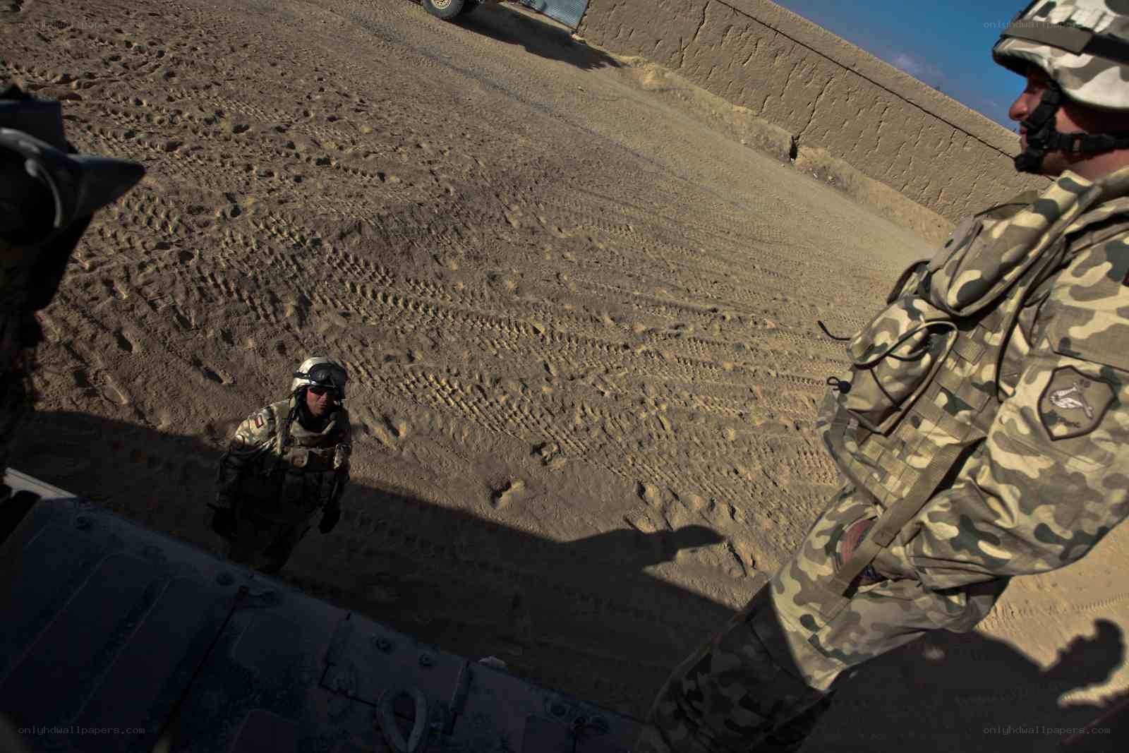 Soldiers in desert terrain