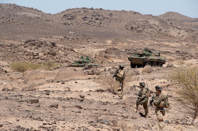 Soldiers in desert terrain