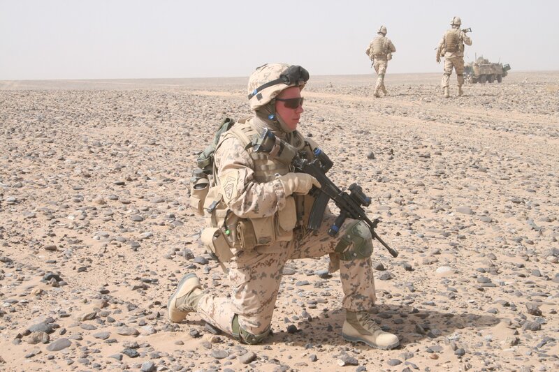 Soldiers in desert terrain