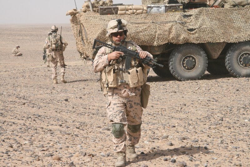 Soldiers in desert terrain
