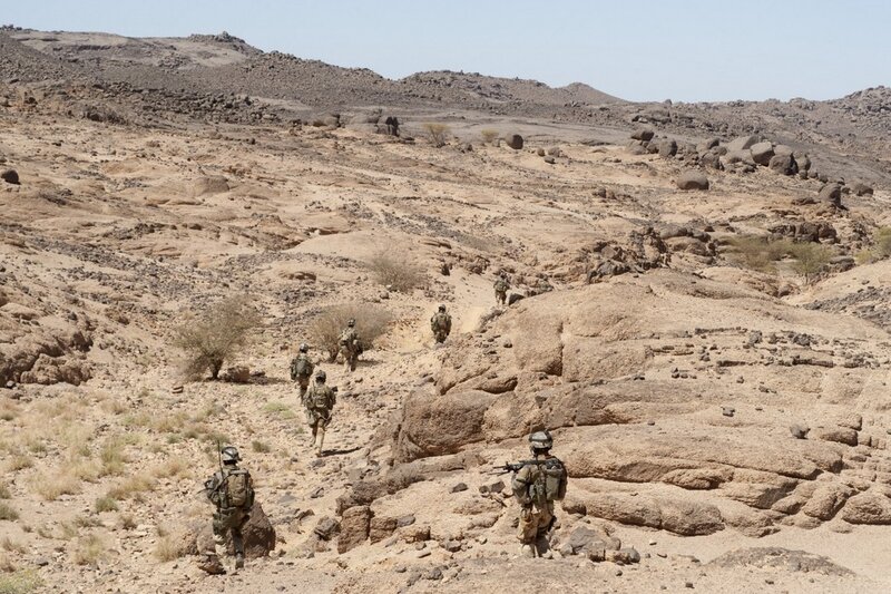 Soldiers in Desert Terrain — Brown, Arid, Afternoon