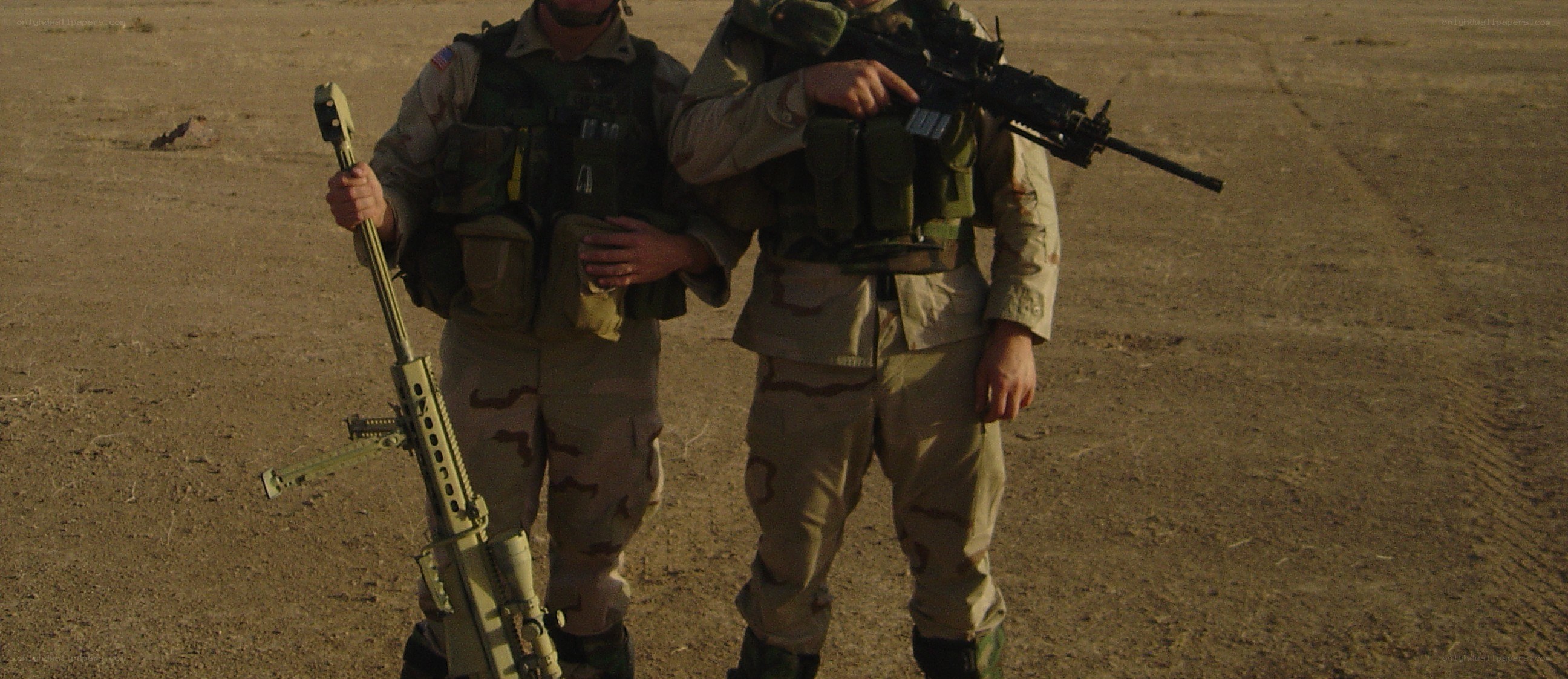 Soldiers in desert terrain