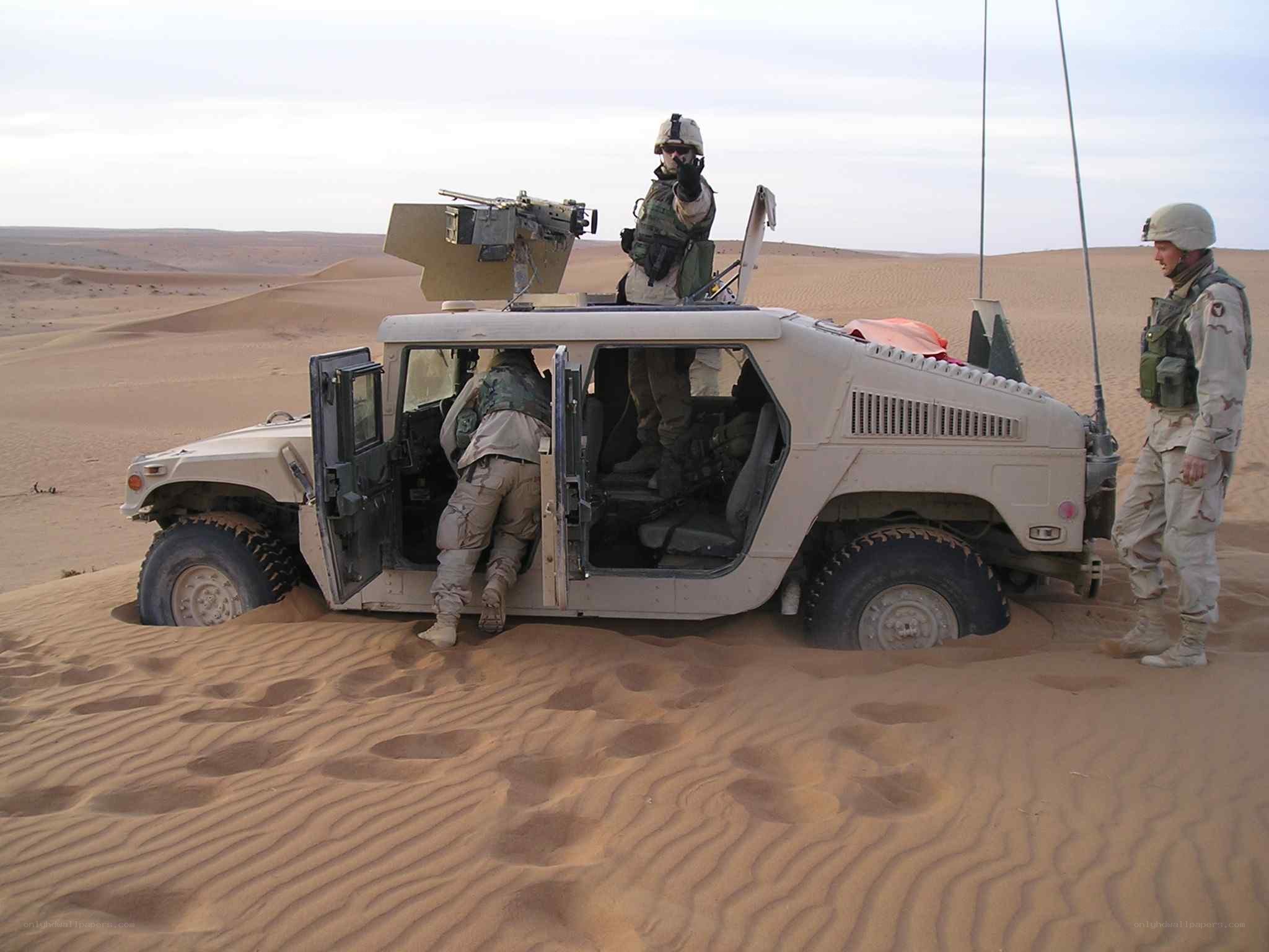 Soldiers in desert vehicle